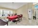 Well-lit dining room featuring tile flooring and a large window at 1019 Lake Berkley Dr, Kissimmee, FL 34746