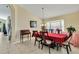 Cozy dining room with a bay window, tile flooring and a traditional chandelier at 1019 Lake Berkley Dr, Kissimmee, FL 34746