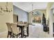 Open-concept dining area with tile floors adjacent to the living room and kitchen at 1019 Lake Berkley Dr, Kissimmee, FL 34746
