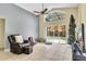 Bright living room with large sliding glass doors that lead to a private pool and patio at 1019 Lake Berkley Dr, Kissimmee, FL 34746