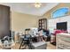 Home office featuring abundant desk space, storage, and natural light from a large window at 1019 Lake Berkley Dr, Kissimmee, FL 34746