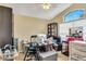 Home office setup with desk, shelves, and natural light, ideal for a productive work environment at 1019 Lake Berkley Dr, Kissimmee, FL 34746