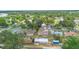 Overhead view of a quiet neighborhood with tree-lined streets and various home styles at 105 E Magnolia St, Davenport, FL 33837