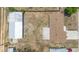 Birds-eye view of a home featuring a spacious backyard, garage and house at 105 E Magnolia St, Davenport, FL 33837