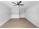 Bedroom featuring a ceiling fan, a double door closet, and vinyl flooring at 105 E Magnolia St, Davenport, FL 33837