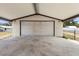 Spacious carport offering sheltered parking and convenient storage options at 105 E Magnolia St, Davenport, FL 33837