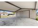 Covered carport with ample space and easy access to the backyard at 105 E Magnolia St, Davenport, FL 33837