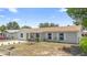 Charming single-story home featuring a neutral exterior paint color, well-kept landscaping, and a new roof at 105 E Magnolia St, Davenport, FL 33837