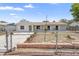 Well-kept home with landscaped front yard, chain link fence and lots of parking spaces at 105 E Magnolia St, Davenport, FL 33837