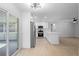Updated kitchen with a stainless steel fridge, an island, and white cabinetry at 105 E Magnolia St, Davenport, FL 33837