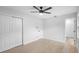 Bright main bedroom with fresh paint, and closet providing ample storage, leading to a modern bathroom at 105 E Magnolia St, Davenport, FL 33837