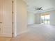 Spacious bedroom with a door leading to the outdoor balcony at 10653 Belfry Cir, Orlando, FL 32832