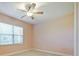 Bedroom featuring a window with blinds and neutral carpeting at 10653 Belfry Cir, Orlando, FL 32832