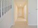 Entryway view featuring tile floors, staircase and a neutral color scheme at 10653 Belfry Cir, Orlando, FL 32832