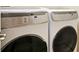 Laundry room featuring a white washer and dryer at 10653 Belfry Cir, Orlando, FL 32832