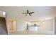 Spacious living space with staircase, kitchen, and tile flooring at 10653 Belfry Cir, Orlando, FL 32832
