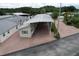 Overhead shot of single-story home with a spacious attached carport at 1115 Deer Creek Blvd, Davenport, FL 33837