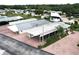 An aerial view of the neighborhood featuring the brick driveways and carports at 1115 Deer Creek Blvd, Davenport, FL 33837