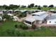 Aerial shot of the property, showcasing its lush landscaping and serene surroundings at 1115 Deer Creek Blvd, Davenport, FL 33837