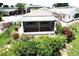 Landscaped backyard with a variety of greenery, creating a peaceful outdoor oasis at 1115 Deer Creek Blvd, Davenport, FL 33837
