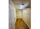 Walk-in closet with shelving and wood flooring providing ample storage space at 1115 Deer Creek Blvd, Davenport, FL 33837