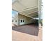 Spacious brick paved carport with ample parking space is attached to the house at 1115 Deer Creek Blvd, Davenport, FL 33837