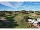 Aerial view of a beautiful golf course with lush green fairways and manicured greens at 1115 Deer Creek Blvd, Davenport, FL 33837