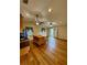 A large living area with wood flooring and a view of the entryway at 1115 Deer Creek Blvd, Davenport, FL 33837