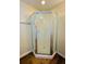 Bathroom shower with a patterned glass door and chrome hardware at 1115 Deer Creek Blvd, Davenport, FL 33837