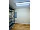 Unfurnished storage room with laminate flooring and shelving provides ample storage space at 1115 Deer Creek Blvd, Davenport, FL 33837
