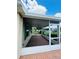 The screened-in lanai provides a relaxing outdoor retreat with brick flooring at 1115 Deer Creek Blvd, Davenport, FL 33837