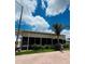 Relaxing sunroom with large glass windows, offering panoramic views of the surrounding scenery at 1115 Deer Creek Blvd, Davenport, FL 33837