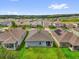 Residential neighborhood featuring well-maintained homes and green spaces on a sunny day at 1156 Cavender Creek Rd, Minneola, FL 34715
