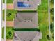 Aerial view of neighborhood homes showing roof tops and solar panels at 1156 Cavender Creek Rd, Minneola, FL 34715