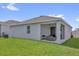 The covered patio in the backyard is the perfect place to relax and enjoy the outdoors at 1156 Cavender Creek Rd, Minneola, FL 34715