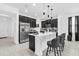 Stylish kitchen featuring an island with seating, stainless steel appliances, and pendant lights at 1156 Cavender Creek Rd, Minneola, FL 34715