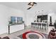Open-concept living space with modern furniture, kitchen island and pendant lighting at 1156 Cavender Creek Rd, Minneola, FL 34715