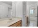 Spacious bathroom with bright vanity and convenient layout, offering comfort and functionality at 11837 Cave Run Ave, Windermere, FL 34786