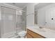 Bright bathroom with a glass-enclosed shower and neutral-toned vanity at 11837 Cave Run Ave, Windermere, FL 34786