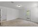 Minimalist bedroom with a private balcony, offering scenic outdoor views at 11837 Cave Run Ave, Windermere, FL 34786