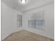Cozy bedroom with carpet flooring, featuring two large windows with blinds at 11837 Cave Run Ave, Windermere, FL 34786
