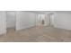 Spacious bedroom with carpet flooring and doorways leading to the closet and bathroom at 11837 Cave Run Ave, Windermere, FL 34786