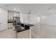 Open-concept kitchen featuring a breakfast bar, stainless steel appliances, and tile flooring at 11837 Cave Run Ave, Windermere, FL 34786