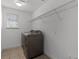 Well-lit laundry room equipped with modern washer and dryer units at 11837 Cave Run Ave, Windermere, FL 34786