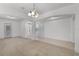 Bright living room with tile and carpeted floors, showcasing an open floor plan at 11837 Cave Run Ave, Windermere, FL 34786