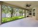 Screened-in patio overlooking a well-maintained lawn at 11837 Cave Run Ave, Windermere, FL 34786