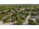 Aerial view of a neighborhood featuring tree-lined streets and mature landscaping at 1209 Russell Dr, Ocoee, FL 34761