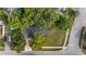 Birds eye view of cozy home with mature landscaping and shaded driveway at 1209 Russell Dr, Ocoee, FL 34761