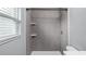 Modern bathroom with a tiled shower, updated fixtures, and ample natural light at 1209 Russell Dr, Ocoee, FL 34761