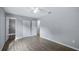 Bedroom featuring neutral walls, new flooring, ceiling fan, and closet storage at 1209 Russell Dr, Ocoee, FL 34761